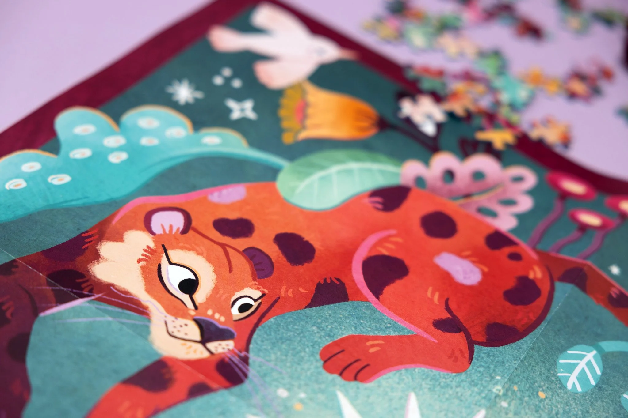 Colorful illustration of a resting leopard surrounded by plants and abstract elements.