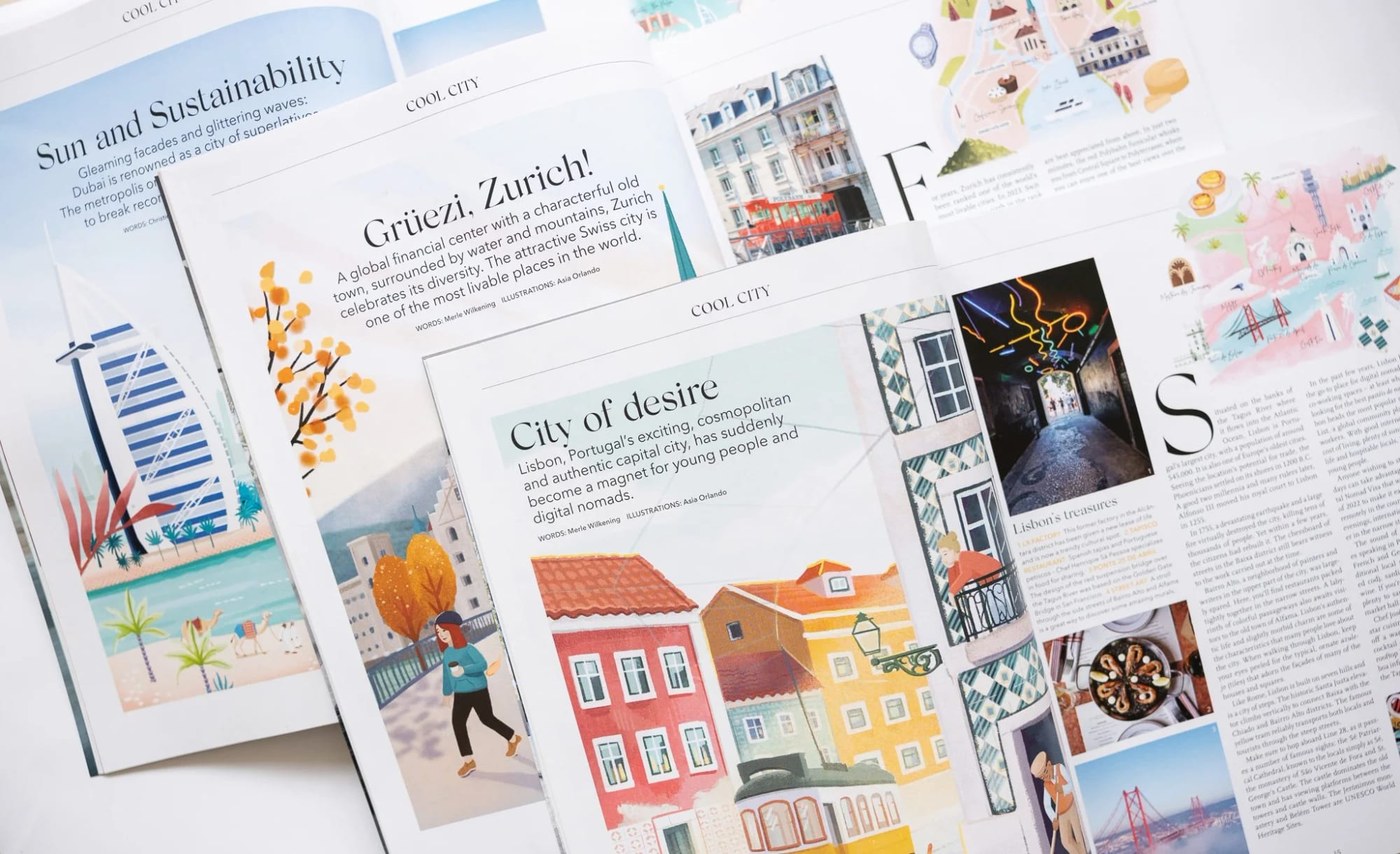 Multiple open travel magazines featuring colorful illustrations and photographs of various cities, including Lisbon, Zurich, and Dubai, with articles on city attractions, architecture, and local culture.