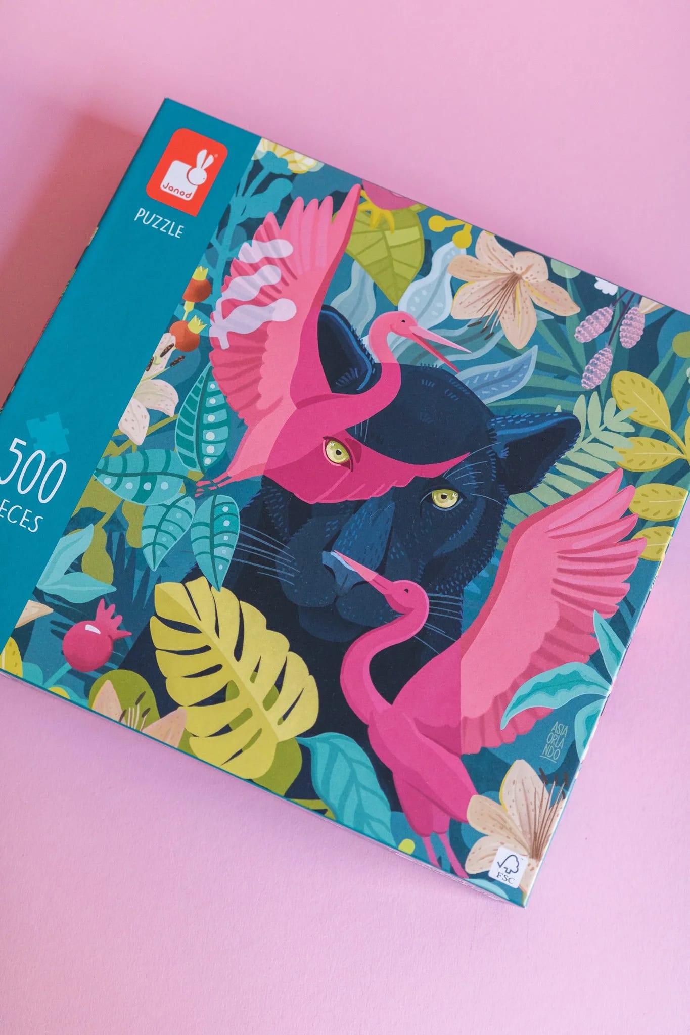 Colorful jungle-themed puzzle box featuring black panther and pink flamingos.