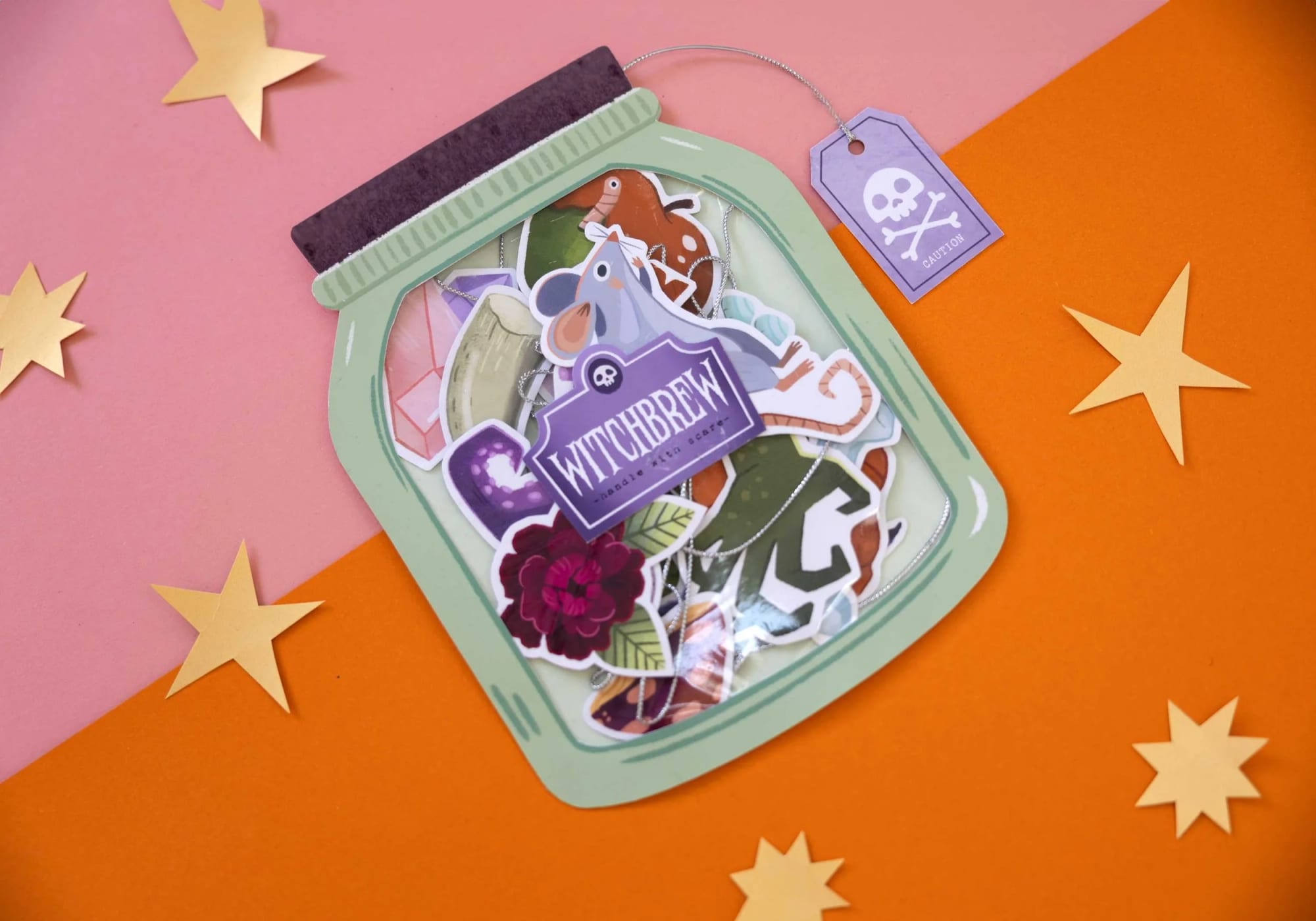 The Witchbrew Halloween Garland illustrated jar card by Asia Orlando, displayed in full.